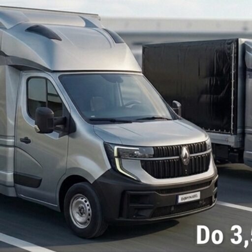 Two modern 3.5 tonne cargo vans driving in parallel on a highway